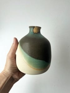 green ceramic bottle
