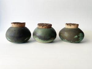 small green ceramic jars