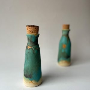 green ceramic bottle