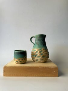 ceramic pitcher and cup